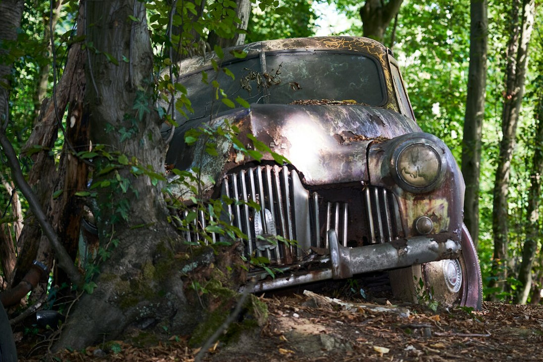 abandoned car in woods