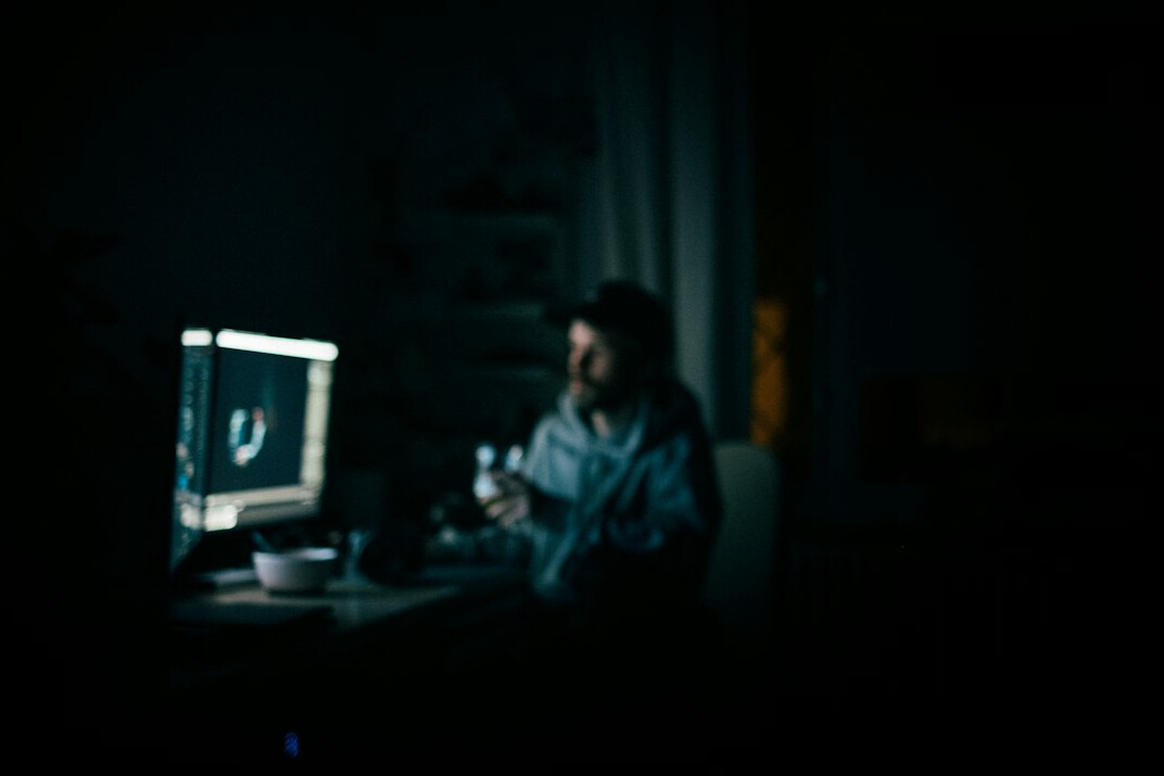 reporter at computer late night